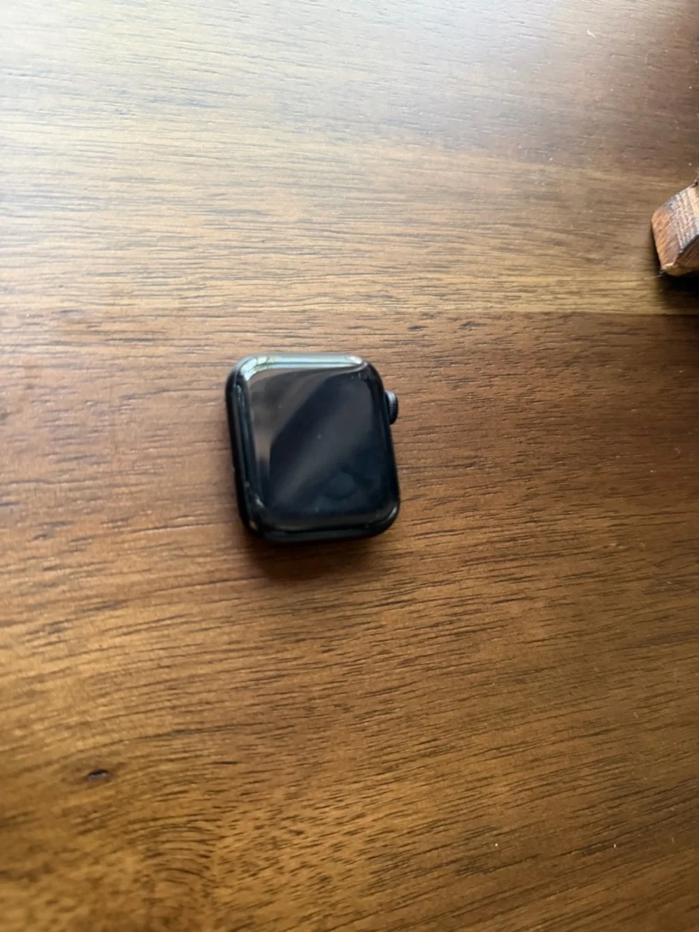 Apple Smartwatch with White Magnetic Charger - Black Watch Face